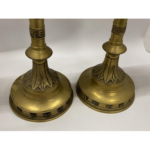 87 - A PAIR OF VINTAGE BRASS GOTHIC STYLE CANDLE HOLDERS, HEIGHT 49CM