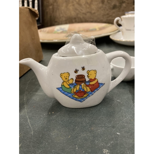 150 - A MINIATURE CHILD'S POTTERY TEASET TO INCLUDE TEAPOT, JUGS, CUPS, ETC WITH A TEDDY BEARS PICNIC DESI... 