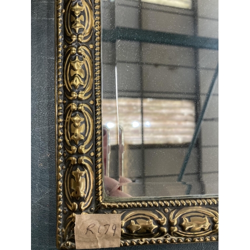 221 - A VINTAGE BRASS FRAMED MIRROR WITH GALLEON TOP AND TWO BRUSHES