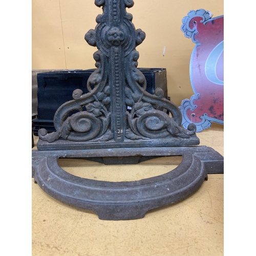 237 - A CAST IRON STICK STAND WITH CHERUB DESIGN