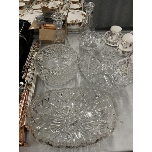 907 - SEVEN CUT GLASS ITEMS TO IONCLUDE THREE LARGE BOWLS, A BON BON DISH AND TWO DECANTERS