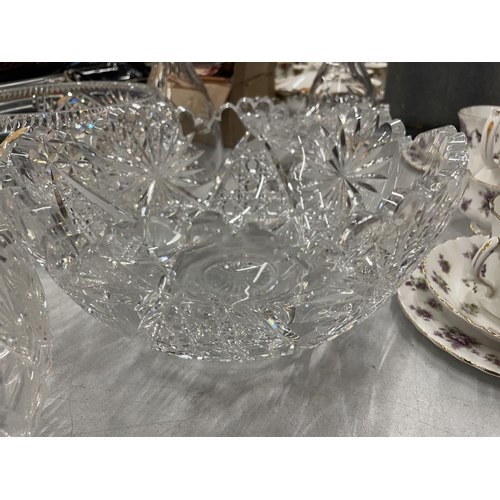 907 - SEVEN CUT GLASS ITEMS TO IONCLUDE THREE LARGE BOWLS, A BON BON DISH AND TWO DECANTERS