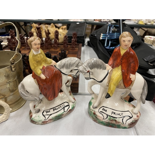 911 - FOUR CERAMIC FIGURES TO INCLUDE TWO STAFFORDSHIRE HORSES, A BORDER FINE ARTS AROUND THE WORLD FIGURE... 