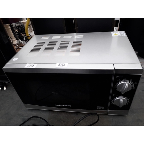 2402 - A SILVER AND BLACK MORPHY RICHARDS MICROWAVE OVEN