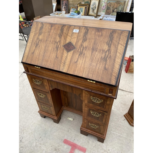 2995 - A WALNUT EFFECT KNEEHOLE PEDESTAL BUREAU