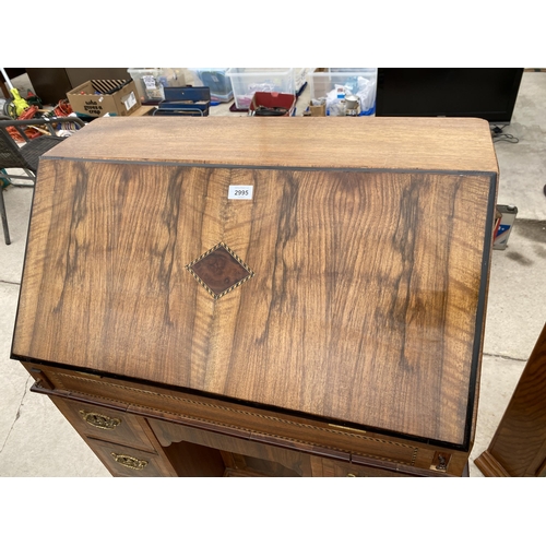 2995 - A WALNUT EFFECT KNEEHOLE PEDESTAL BUREAU