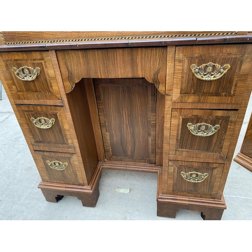 2995 - A WALNUT EFFECT KNEEHOLE PEDESTAL BUREAU