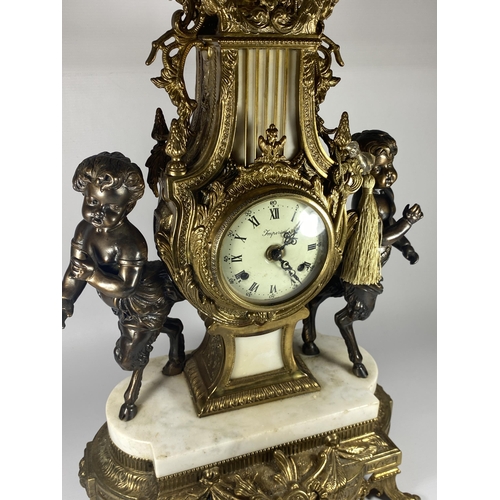 11 - A C.1900 ITALIAN REPRODUCTION MANTLE CLOCK BY IMPERIAL IN BRASS WITH MARBLE BASE AND CHERUBS, HEIGHT... 