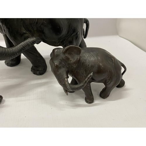 84 - A SET OF THREE VINTAGE SPELTER/LEAD ELEPHANT MODELS, HEIGHT 19CM