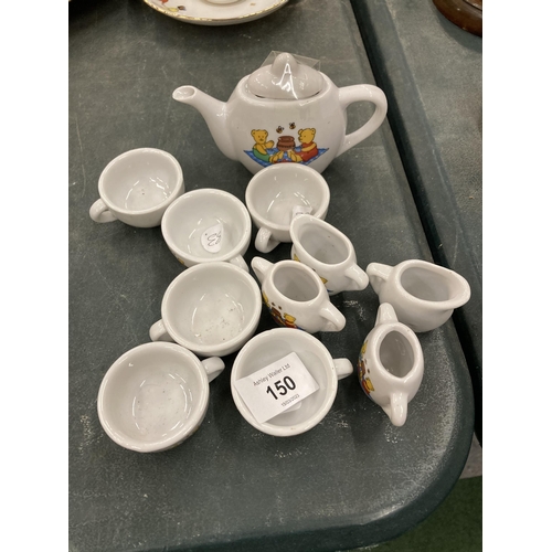150 - A MINIATURE CHILD'S POTTERY TEASET TO INCLUDE TEAPOT, JUGS, CUPS, ETC WITH A TEDDY BEARS PICNIC DESI... 