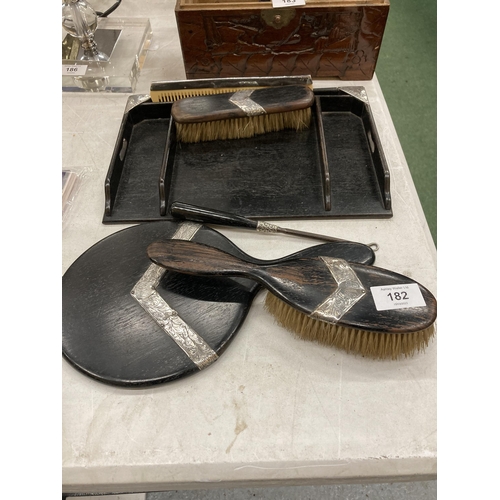 182 - A SILVER AND EBONY DRESSING TABLE SET