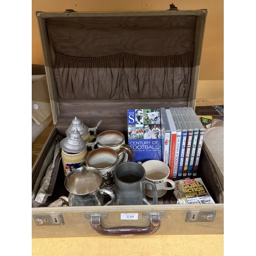 230 - A VINTAGE ANTLER SUITCASE CONTAINING STEINS, TANKARDS FOOTBALL DVD'S, ETC