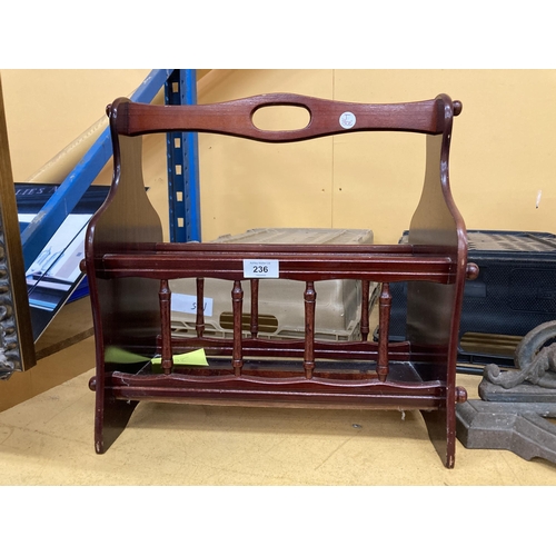 236 - A MAGAZINE RACK