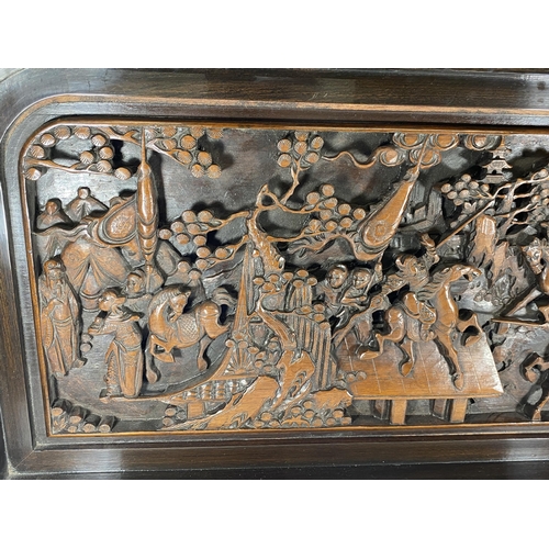 429 - A LARGE HEAVILY CARVED ORIENTAL PLAQUE DEPICTING WARRIOR DESIGN, 91 X 46CM