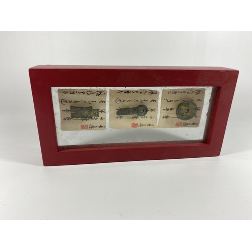 430A - AN ORIENTAL FRAMED ARTIFACT DISPLAY