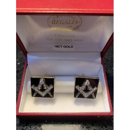 504A - A PAIR OF 18 CARAT YELLOW GOLD FRONTED WITH 18 CARAT WHITE GOLD CUFF LINKS EACH DECORATED WITH A DIA... 