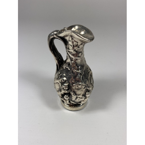 603 - A SILVER GRECIAN DESIGN SMALL JUG