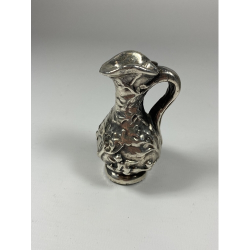 603 - A SILVER GRECIAN DESIGN SMALL JUG