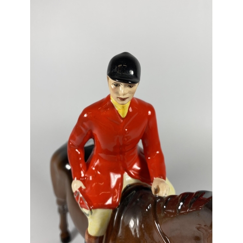 857 - A BESWICK HUNTSMAN ON HORSEBACK FIGURE IN RED JACKET