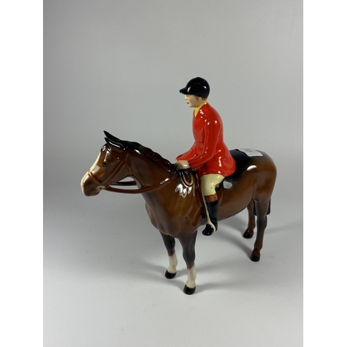 857 - A BESWICK HUNTSMAN ON HORSEBACK FIGURE IN RED JACKET