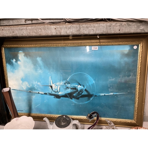 1140 - A LARGE GILT FRAMED PRINT OF A SPITFIRE AEROPLANE 102CM X 62CM