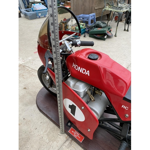 1504 - A HONDA RC166 MODEL FAIRGROUND RIDE MOUNTED ON A WOODEN PLINTH