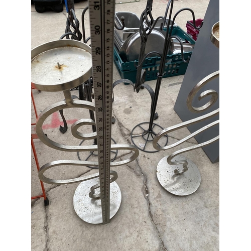 1641 - AN ASSORTMENT OF DECORATIVE METAL CANDLE HOLDERS AND COAT STANDS ETC