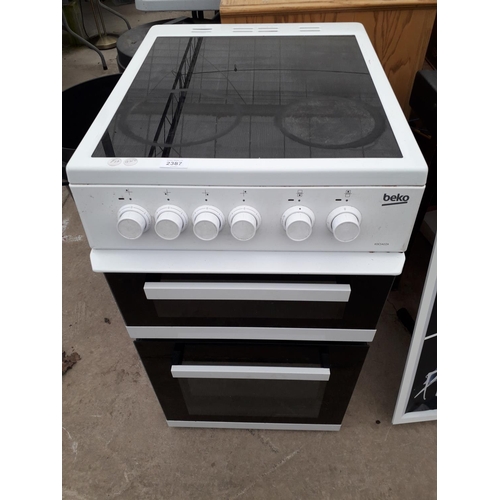 2387 - A WHITE BEKO FREESTANDING ELECTRIC OVEN AND HOB BELIEVED WORKING BUT NO WARRANTY