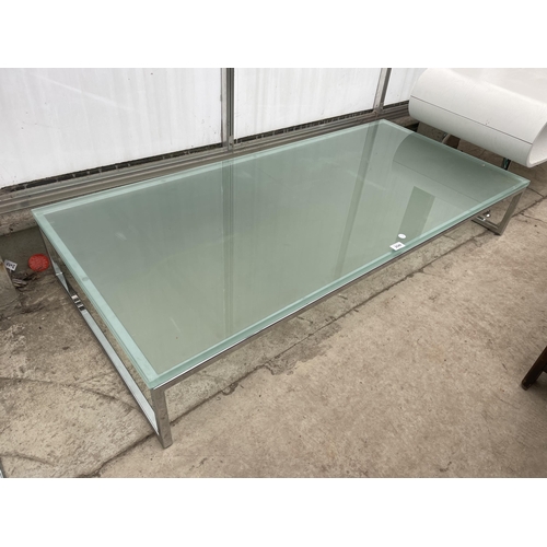 2540 - A MODERNIST LOW COFFEE TABLE ON POLISHED FROSTED GLASS TOP, 55X26