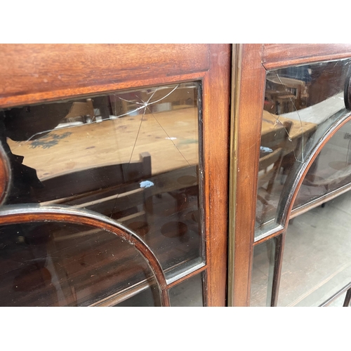 2548 - A 19TH CENTURY MAHOGANY AND INLAID TWO DOOR GLAZED BOOKCASE ON BRACKET FEET, 43.5