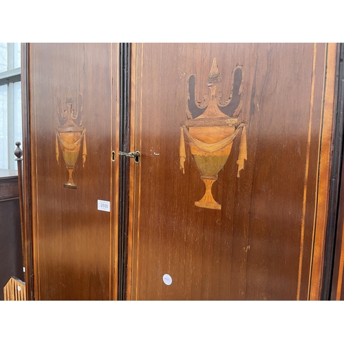 2550 - AN EDWARDIAN MAHOGANY AND VASE INLAID CORNER CUPBOARD WITH ARCHED TOP DOORS, SINGLE DRAWER AND CUPBO... 