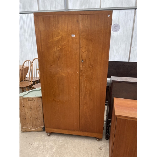 2597 - A RETRO TEAK TWO DOOR WARDROBE, 36