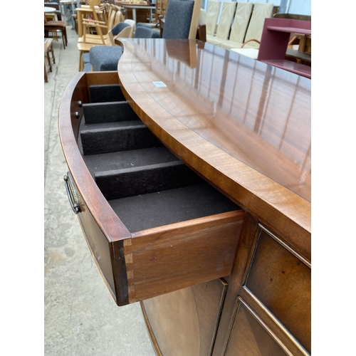 2711 - A MAHOGANY AND CROSSBANDED 'REPRODUX' SERPENTINE FRONTED SIDEBOARD, 60