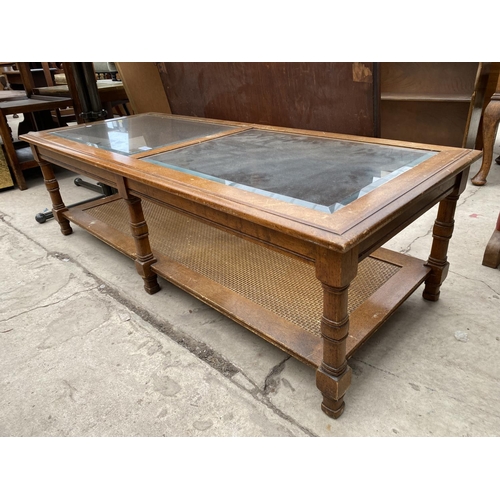 2721 - A HARDWOOD AND WICKER COFFEE TABLE WITH INSET GLASS TOP, 51 X 21