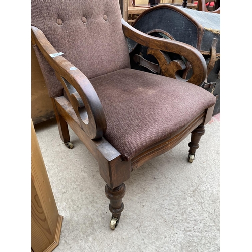 2773 - A VICTORIAN MAHOGANY OPEN FIRESIDE CHAIR ON TURNED FRONT LEGS