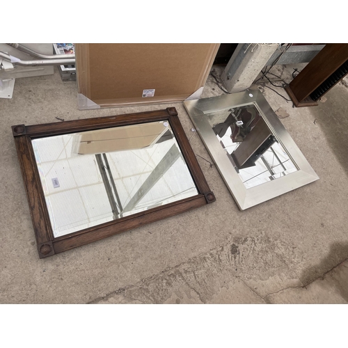 2853 - AN OAK FRAMED WALL MIRROR AND SILVER COLOURED MIRROR