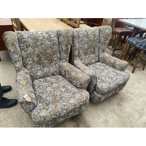 2881 - A PAIR OF FLORAL UPHOLSTERED WINGED EASY CHAIRS