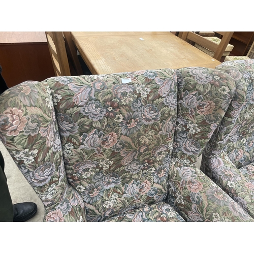 2881 - A PAIR OF FLORAL UPHOLSTERED WINGED EASY CHAIRS