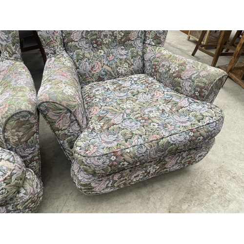 2881 - A PAIR OF FLORAL UPHOLSTERED WINGED EASY CHAIRS