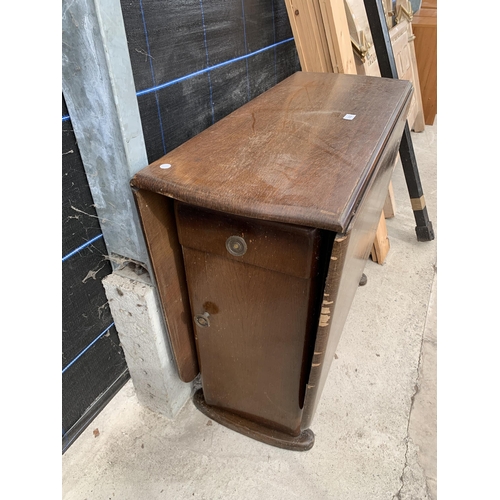 2920 - A MID 20TH CENTURY OAK DROP LEAF DINING TABLE WITH TWO END CUPBOARDS AND ONE DRAWER