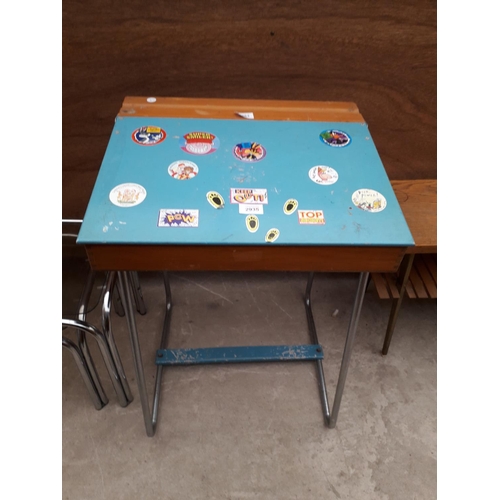 2963 - A MODERN CHILDS DESK ON A TUBULAR FRAME