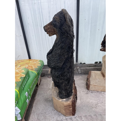 101 - A CARVED WOODEN ORNAMENT OF A WELCOME BEAR NO VAT