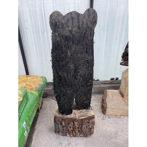 101 - A CARVED WOODEN ORNAMENT OF A WELCOME BEAR NO VAT