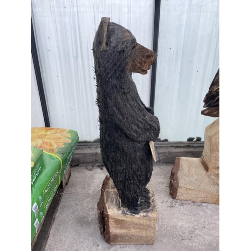 101 - A CARVED WOODEN ORNAMENT OF A WELCOME BEAR NO VAT