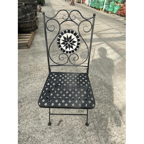 88 - A ROUND TILE TOP BISTRO TABLE AND TWO FOLDING CHAIRS WITH TILED BACKS (ONE CHAIR HAS A STRETCHER A/F... 