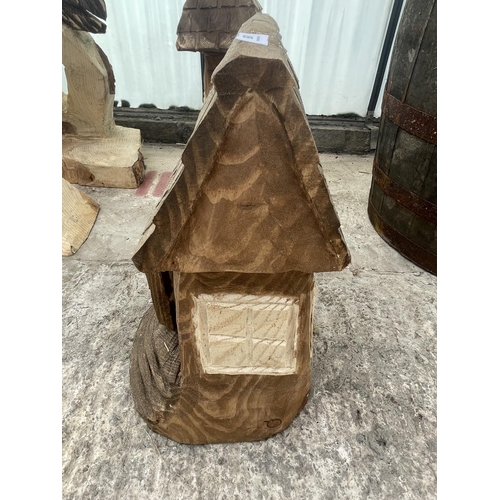 95 - A CARVED WOODEN ORNAMENT OF A FAIRY HOUSE NO VAT