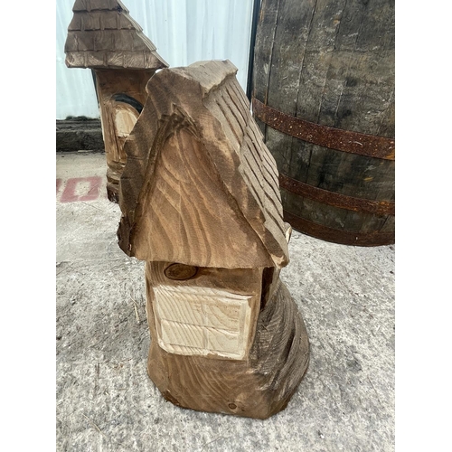 95 - A CARVED WOODEN ORNAMENT OF A FAIRY HOUSE NO VAT