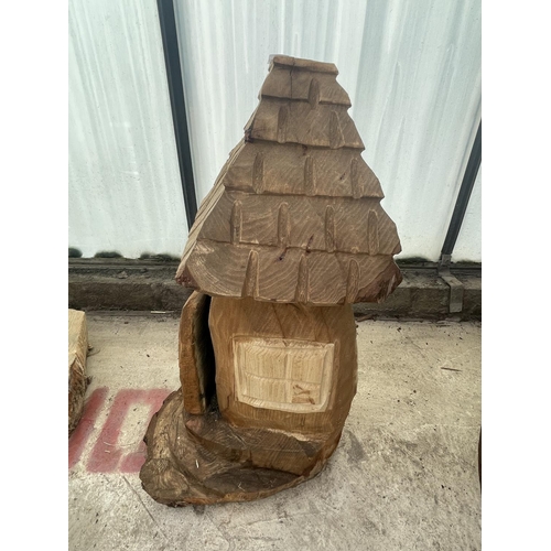 96 - A CARVED WOODEN ORNAMENT OF A FAIRY HOUSE NO VAT