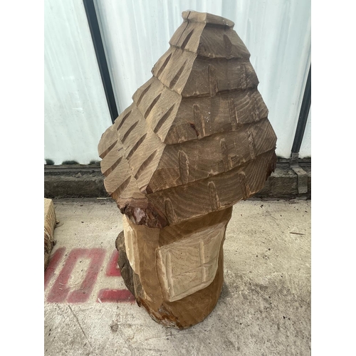 96 - A CARVED WOODEN ORNAMENT OF A FAIRY HOUSE NO VAT