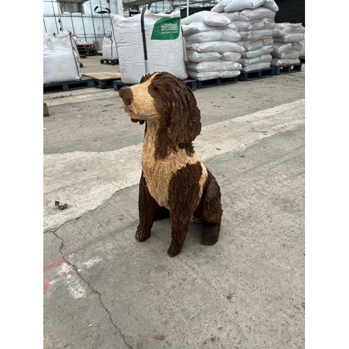 237 - A CARVED WOODEN BROWN & WHITE DOG APPROX 70 CM HIGH NO VAT